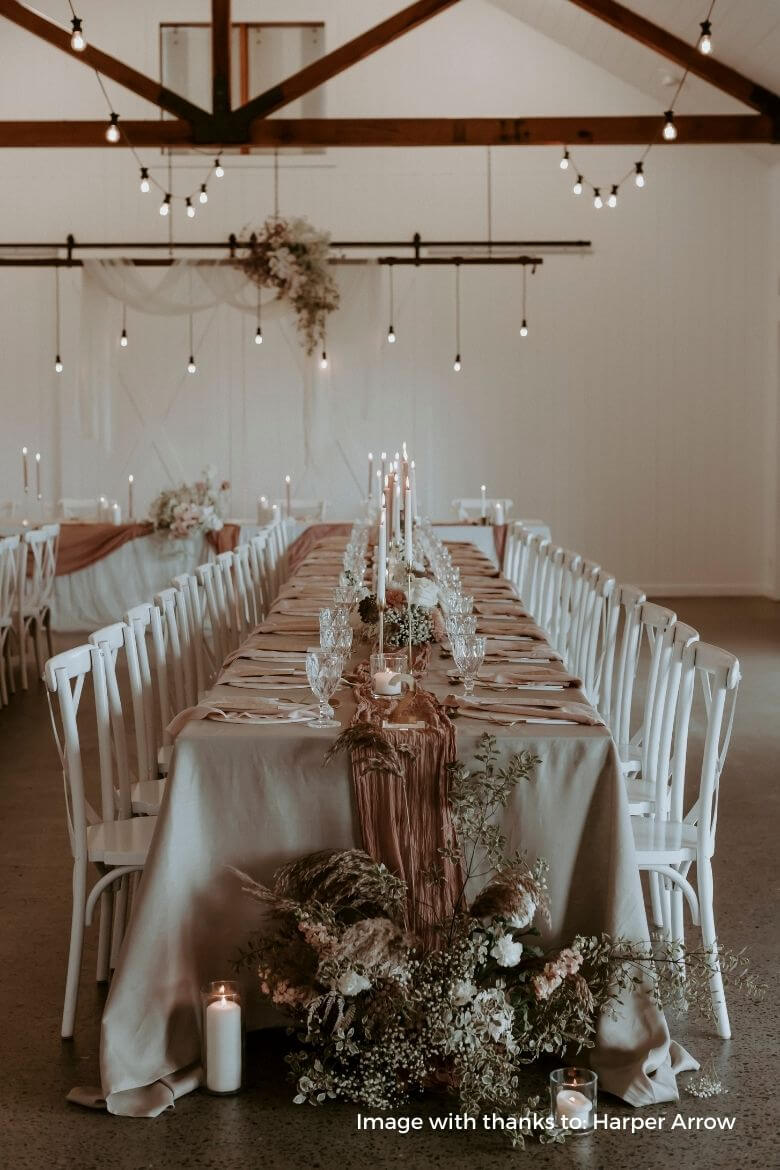 Long wedding tables with blush dinner candles